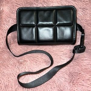 Black quilted belt bag.